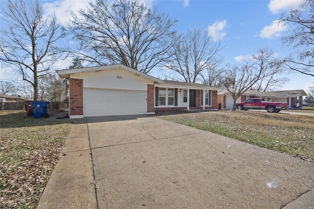 ranch-style home with brick siding, an attached garage, concrete driveway, and fence