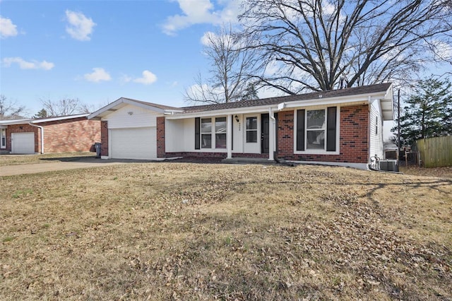 ranch-style house featuring brick siding, an attached garage, a front lawn, central air condition unit, and driveway