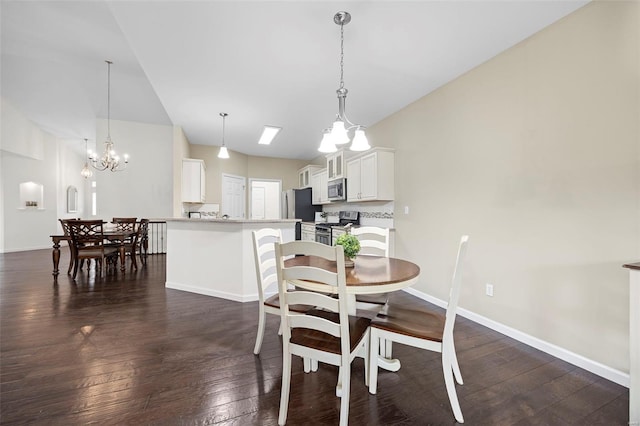 dining area featuring baseboards, dark wood-style floors, vaulted ceiling, and a notable chandelier