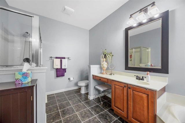 full bathroom with vanity, tile patterned floors, toilet, and a shower with door