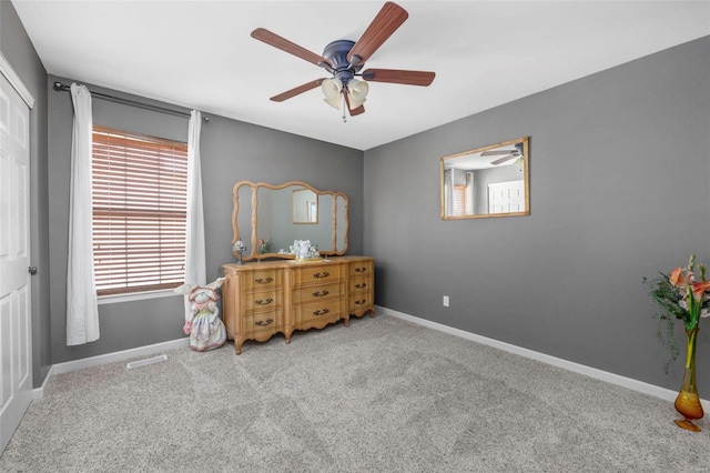 bedroom with carpet flooring, baseboards, and ceiling fan