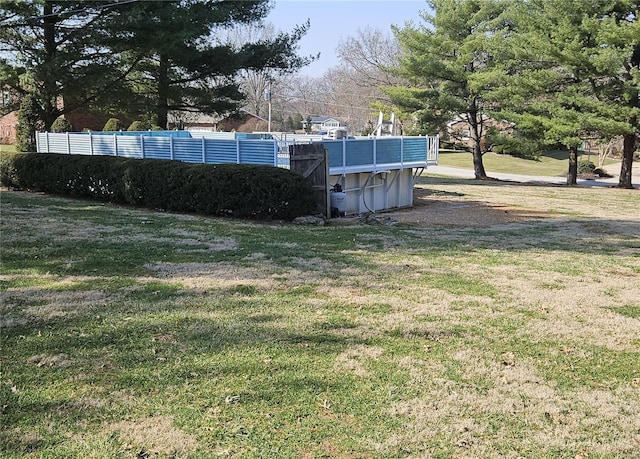 view of yard featuring an outdoor pool