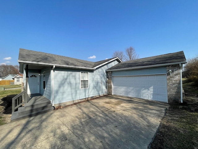 ranch-style house featuring driveway and a garage