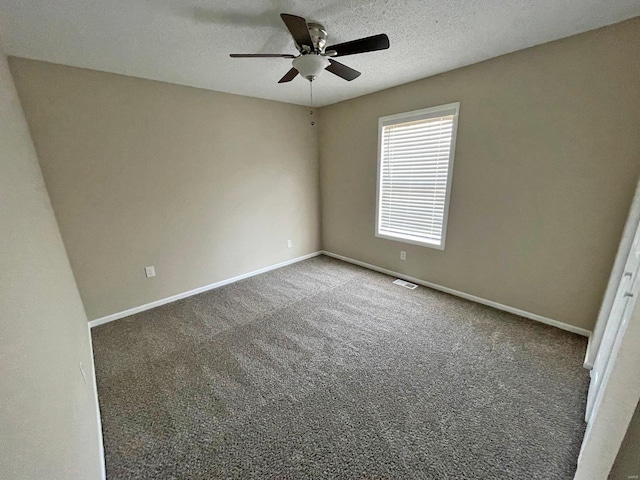 unfurnished bedroom featuring visible vents, baseboards, carpet, and a textured ceiling