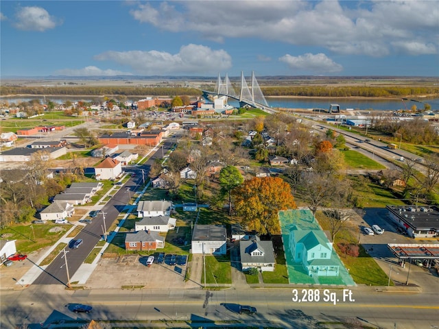 drone / aerial view with a water view and a residential view