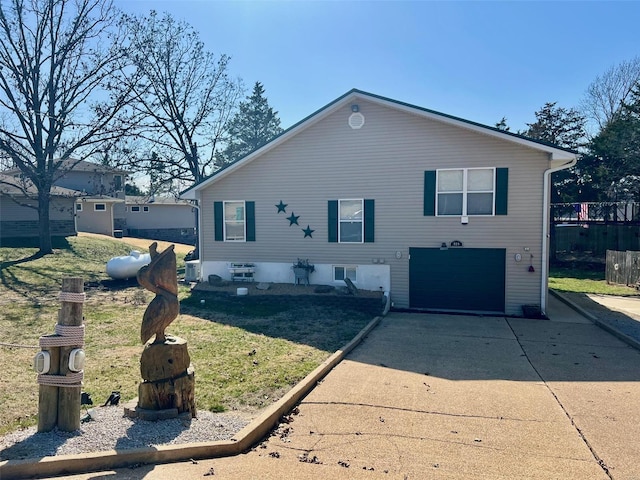 exterior space featuring an attached garage and driveway