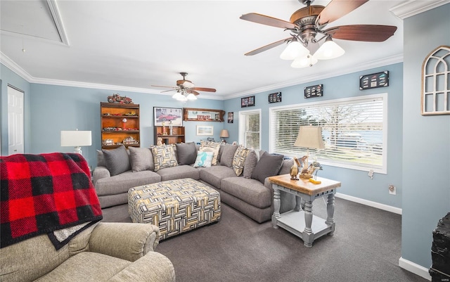 living room featuring carpet floors, attic access, baseboards, ceiling fan, and ornamental molding