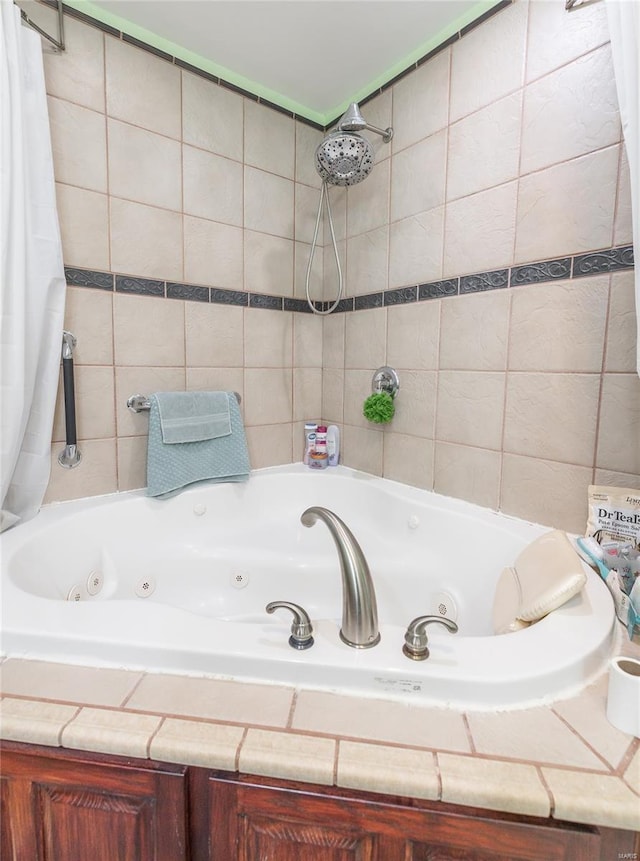 bathroom with tile walls and a combined bath / shower with jetted tub