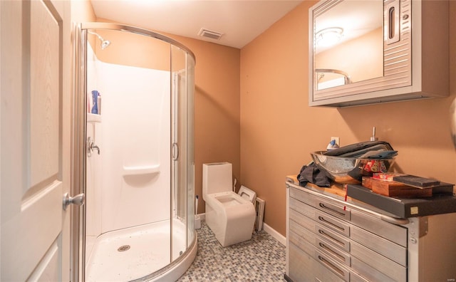 full bathroom featuring a shower stall, baseboards, and visible vents