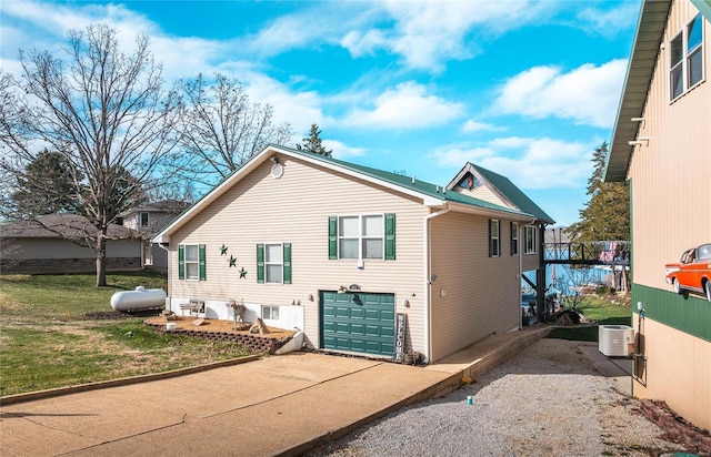 exterior space with a garage and concrete driveway