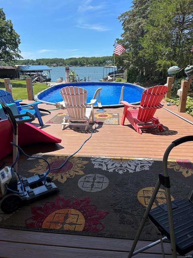 outdoor pool featuring a deck with water view