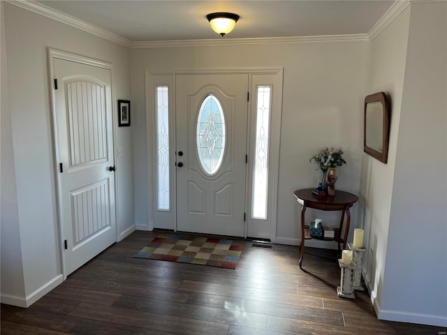 entryway featuring dark wood-type flooring, baseboards, and ornamental molding