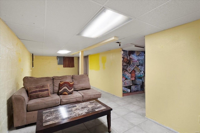 living room with a paneled ceiling