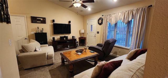 living area with vaulted ceiling, a ceiling fan, baseboards, and carpet floors