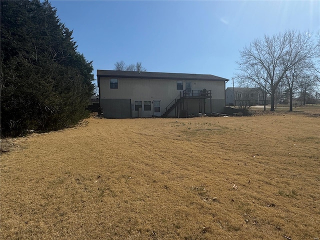 rear view of property featuring stairs