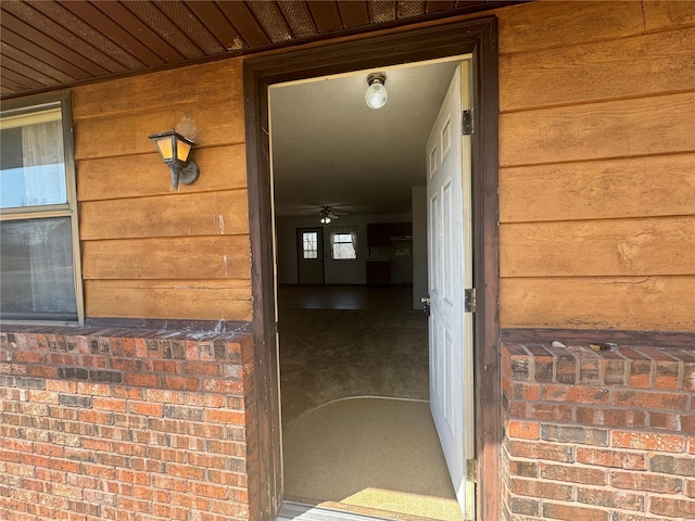 entrance to property with brick siding