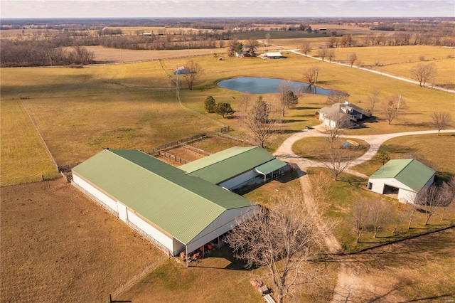 aerial view with a rural view and a water view