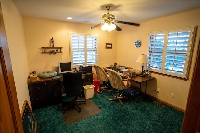 carpeted home office with visible vents and ceiling fan