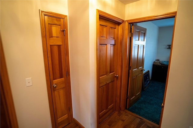 corridor featuring dark wood-style floors