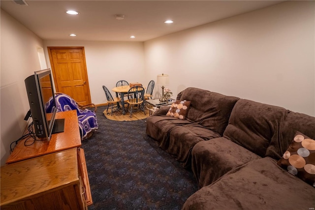 carpeted living area featuring recessed lighting