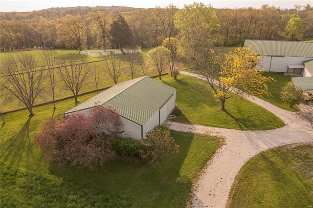 aerial view featuring a forest view and a rural view