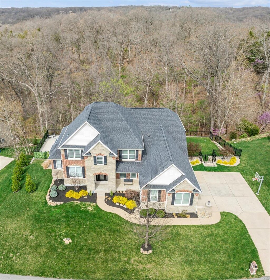 aerial view featuring a wooded view