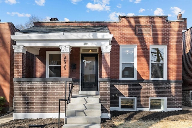 view of front of house with brick siding