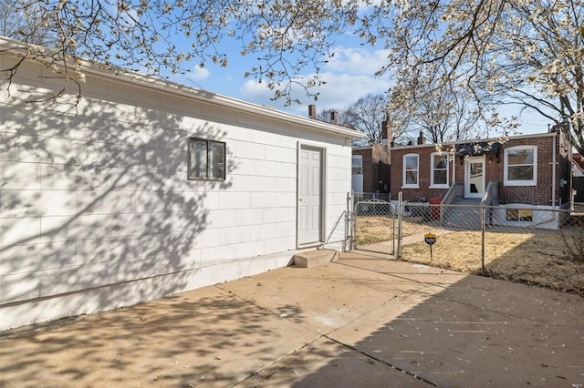 exterior space featuring a fenced front yard and a gate