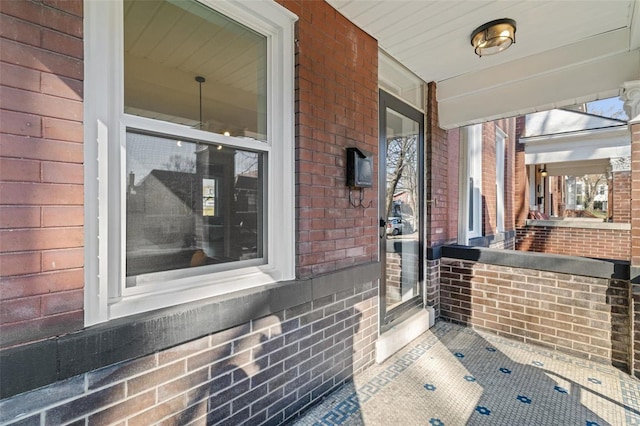 bathroom with brick wall