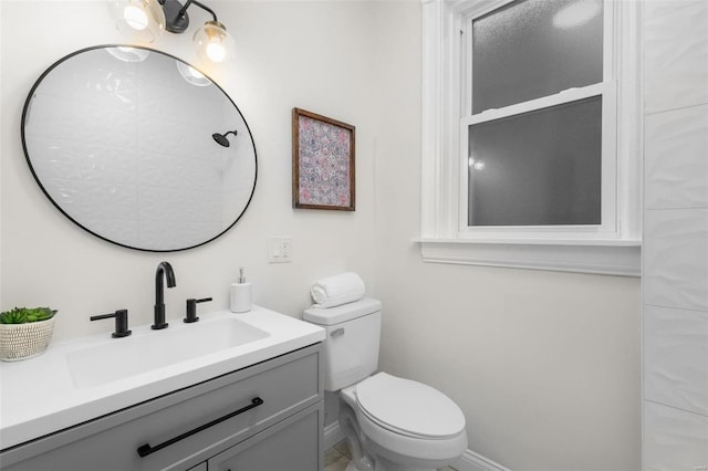 bathroom with toilet and vanity