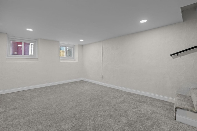 below grade area featuring carpet flooring, recessed lighting, and baseboards