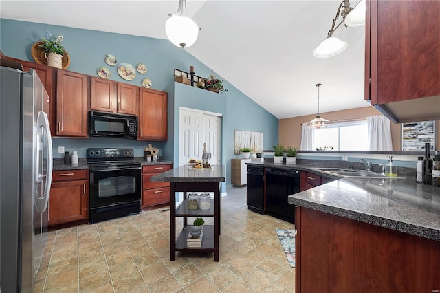 kitchen with black appliances, a sink, decorative light fixtures, a peninsula, and brown cabinetry