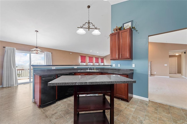 kitchen featuring a peninsula, pendant lighting, baseboards, and a center island