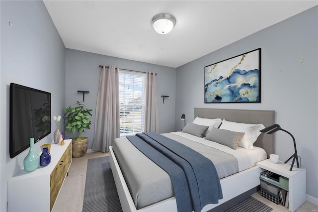 carpeted bedroom featuring baseboards