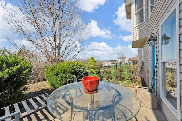 view of patio / terrace with outdoor dining space and fence