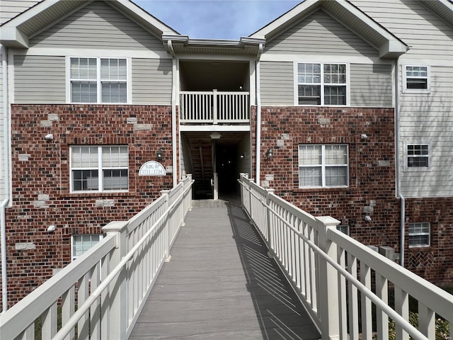 exterior space with brick siding