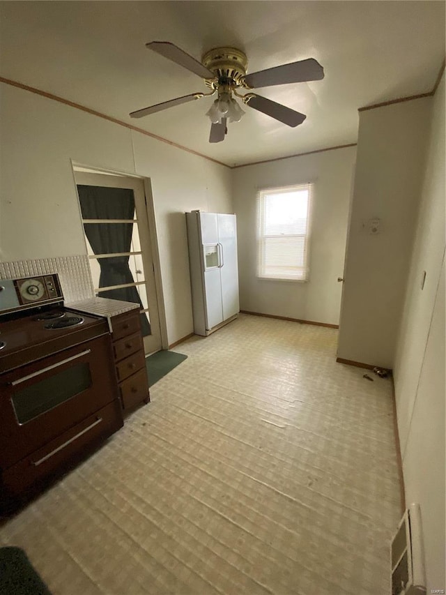 kitchen with black / electric stove, a ceiling fan, visible vents, white refrigerator with ice dispenser, and crown molding