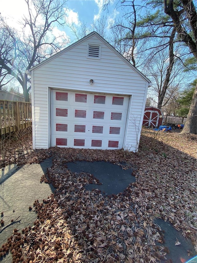 garage featuring fence