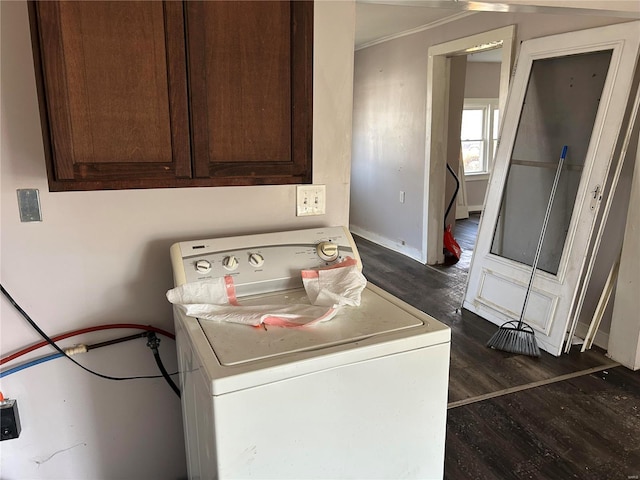 laundry room featuring crown molding, baseboards, washer / dryer, cabinet space, and dark wood-style flooring