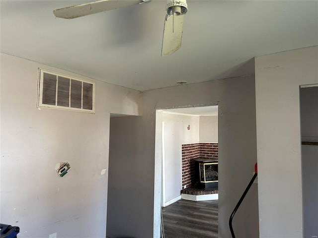 corridor with visible vents and wood finished floors