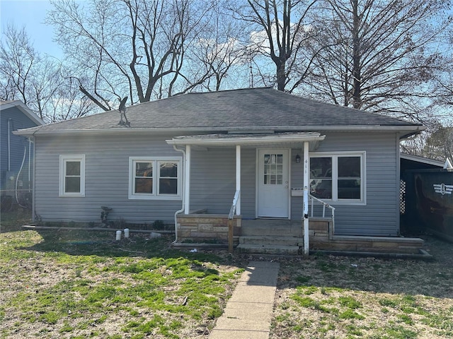 bungalow-style house featuring a shingled roof