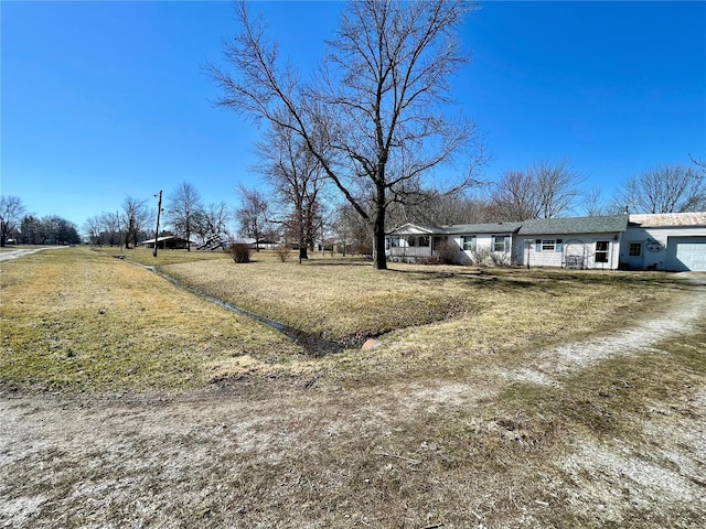 view of yard with an attached garage