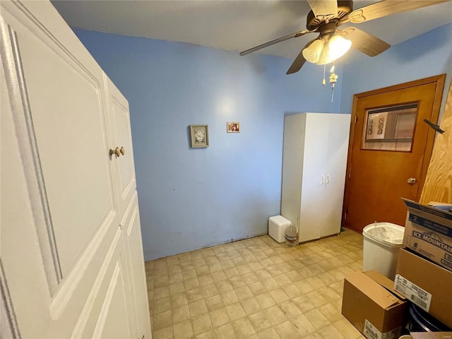 interior space featuring a ceiling fan and light floors