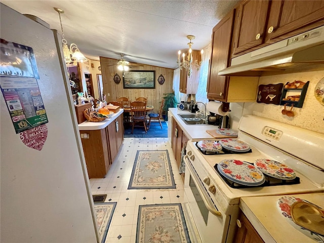 kitchen featuring under cabinet range hood, a sink, white electric range oven, brown cabinetry, and light countertops