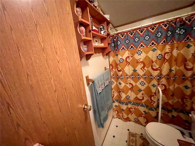 bathroom with a shower with shower curtain and toilet