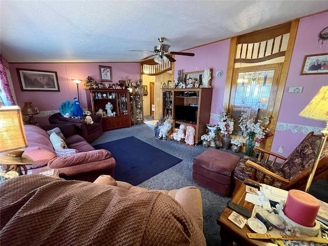 carpeted living area featuring a textured ceiling and a ceiling fan