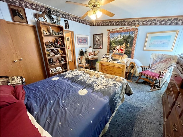 bedroom with a ceiling fan and carpet floors