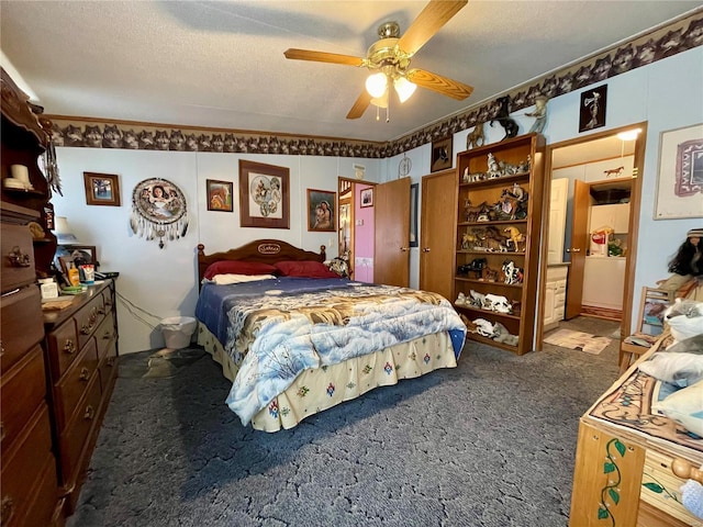 bedroom with carpet, ceiling fan, and a textured ceiling