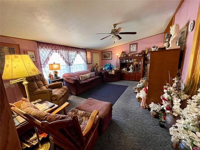 carpeted living area featuring ceiling fan, lofted ceiling, and a textured ceiling