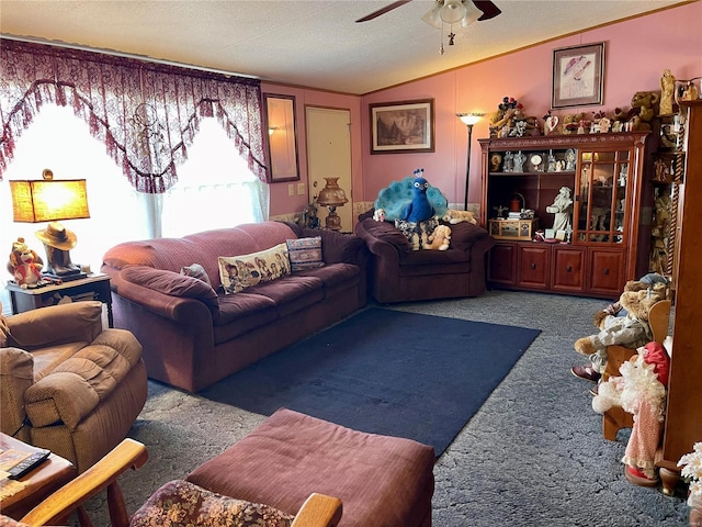 living room featuring ceiling fan, carpet flooring, and vaulted ceiling